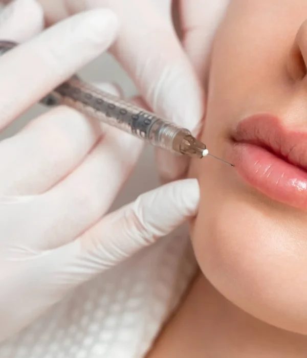 A practitioner preparing a treatment
